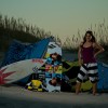 a girl kiteboarder shows off her gear a girl kiteboarder shows off her gear