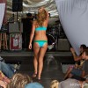 a swimsuit model walks down the runway