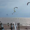 Kiteboarders riding on lake michigan