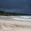 Sandy beaches blown by strong winds and dark skys in South Haven MI