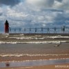 a stormy scene of the south haven mi lighthouse
