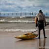 a kayaker looks out at the rough waters before heading back out for a paddle