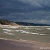 Kitesurfers out on lake michigan in stormy conditions