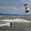 a kiteboarder riding on lake michigan