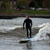 a surfer riding in lake michigan