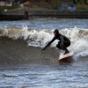 a surfer riding in lake michigan