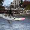 a surfer riding in lake michigan