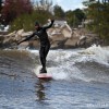 a surfer cross stepping in lake michigan