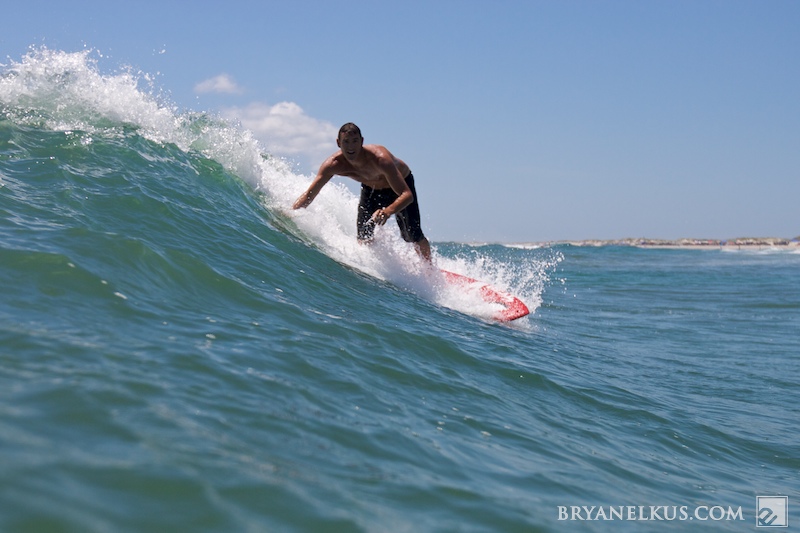 Sam August catches a wave in cape hattears, nc