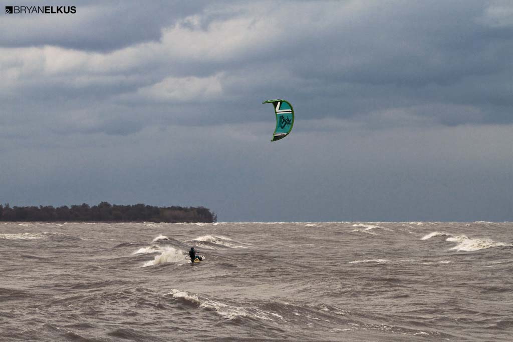a kiteboarder riding in lake erie